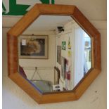 A maple framed octagonal wall mirror