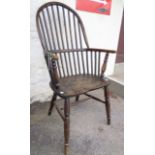 An antique elm comb back Windsor chair - live woodworm to seat and spindles