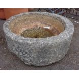 A circular granite trough with polished interior - diameter 25"