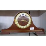 A vintage stained walnut cased Napoleon hat mantel clock with German floating balance eight day