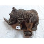 A carved stone rhino - one leg a/f