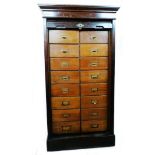 A 24" early 20th Century polished walnut "The Lebus Cabinet" with two flights of eight drawers