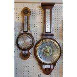 A small oak framed aneroid banjo barometer/thermometer - sold with another with visible works