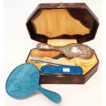 A cased vintage pearlised hand mirror brush and comb set - sold with a damaged silver backed brush