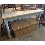 A 3' 10" pine scrub top kitchen table, set on painted base