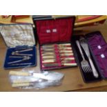 Two pairs of fish servers, boxed set of fish knives and forks and a boxed pair of nutcrackers with