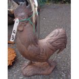 A cast iron cockerel with rusted finish