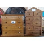 Two miniature chests of drawers