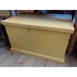 A 31 1/2" old painted pine lift-top box with flanking iron drop handles