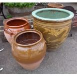 A large glazed plant pot with Chinese dragon decoration - sold with two others