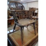 An antique Windsor comb back elbow chair with solid elm seat - a/f