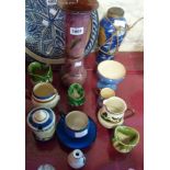 A collection of Torquay pottery including marmalade pot, cup with saucer, violet pot, vase (a/f),