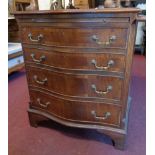 A 28" reproduction mahogany and cross banded serpentine front bachelor's chest with brushing slide