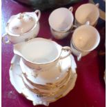 A Royal Crown Derby Devonshire pattern six place tea set including sugar bowl, milk jug and cake