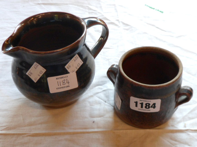 Two pieces of Leach, St. Ives pottery, comprising a small two handled pot and a jug with