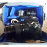 An Olympus OM101 with lenses, in carry case