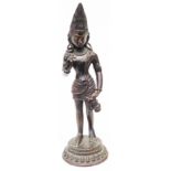 An Indian filled bronze male Buddhist figure wearing a pointed crown and holding an open lotus and a