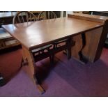 A 4' 20th Century polished oak refectory style dining table, set on shaped standard ends with pegged