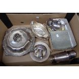 A box containing a quantity of silver plated items including ornate entrée dish, pair of gravy