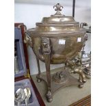 An Egyptian revival silver plated urn with raised supports and tap - 16 1/2" high