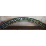 A reproduction painted cast iron Flying Scotsman sign