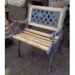 A cast iron and slatted wood garden seat