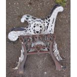 A pair of cast iron bench ends and table brackets