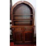 A 33 1/2" reproduction oak two-part dresser with domed two shelf open plate rack over two short