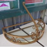 A gilt finished console table with glass top