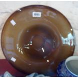 A large continental brown art glass shallow bowl