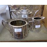 A late Victorian silver plated three piece tea set of fluted tapered design with engraved decoration