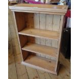 A 23 1/4" modern waxed pine three shelf open bookcase