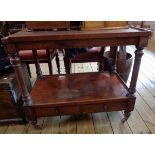 A 31 1/4" 19th Century mahogany two-tier buffet with turned supports and two drawers under, set on