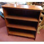 A 30 1/2" polished oak three shelf open bookcase