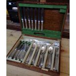 An Elkington & Co. oak canteen containing a part set of associated silver plated cutlery