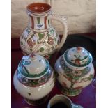A pair of Chinese temple jars and a terracotta ewer