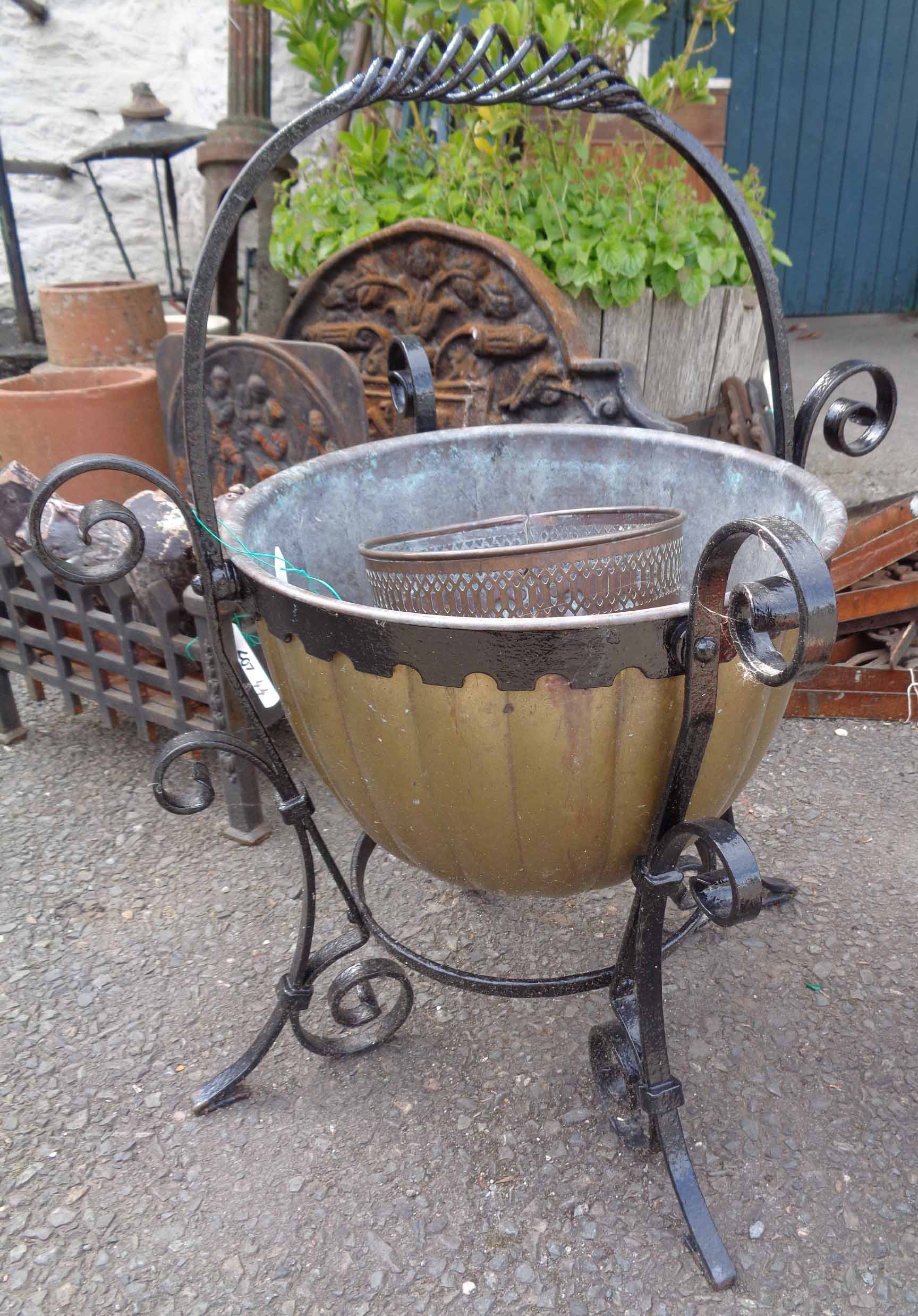 A painted wrought iron and brass coal bucket - sold with a pierced copper pot