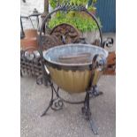 A painted wrought iron and brass coal bucket - sold with a pierced copper pot