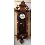 A walnut cased Vienna regulator style wall clock with twin weight driven gong striking movement -