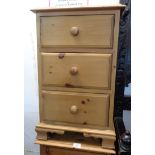 A pair of 17" modern waxed pine bedside chests of three drawers, set on bracket feet