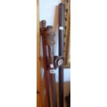 Two wooden curtain poles with mounts and rings