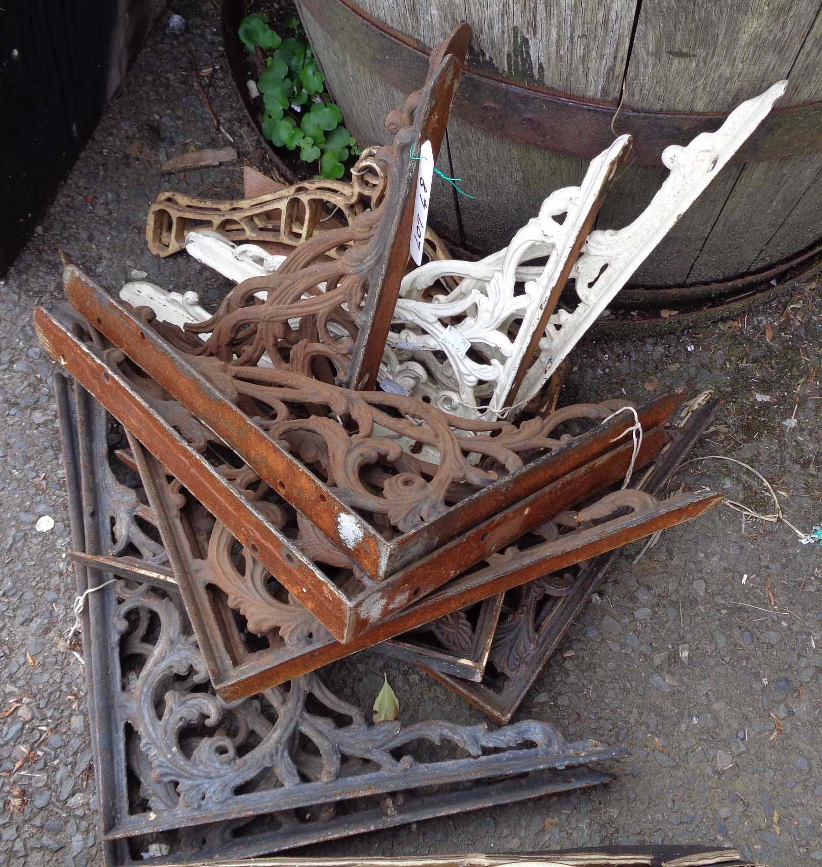 A quantity of assorted cast iron brackets