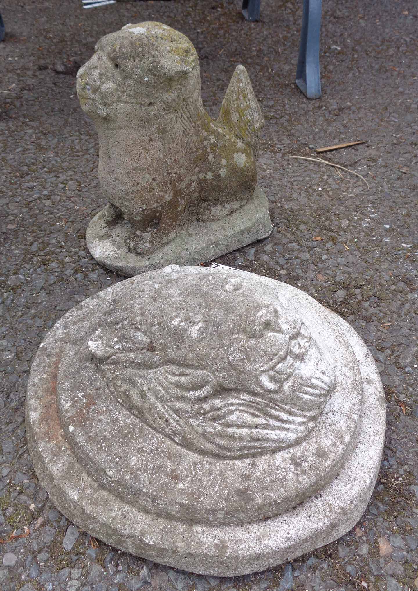 A pre-cast lion mask and a small lion garden ornament