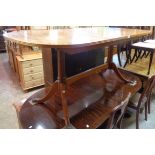 A modern McIntosh mahogany and cross banded style D-end extending dining table with stowed leaf, set