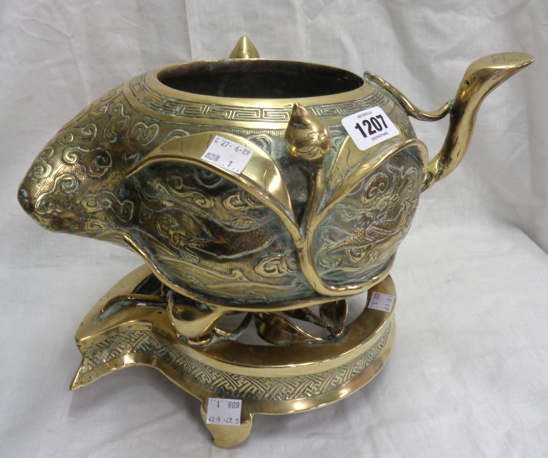 An antique Chinese bronze censer of asymmetric form with engraved air dragon and meandering - Image 4 of 13