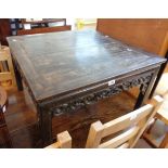 A 30" 1920's Chinese stained hardwood low table with decorative pierced apron, set on typical