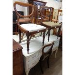 Three matching early Victorian rosewood framed balloon back dining chairs with drop-in seats and