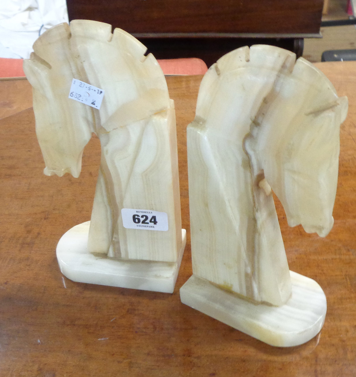 A pair of soapstone knight chess piece pattern bookends