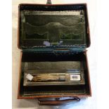 A small leather case, glass pen tray and a late Victorian engraved white metal paper knife handle
