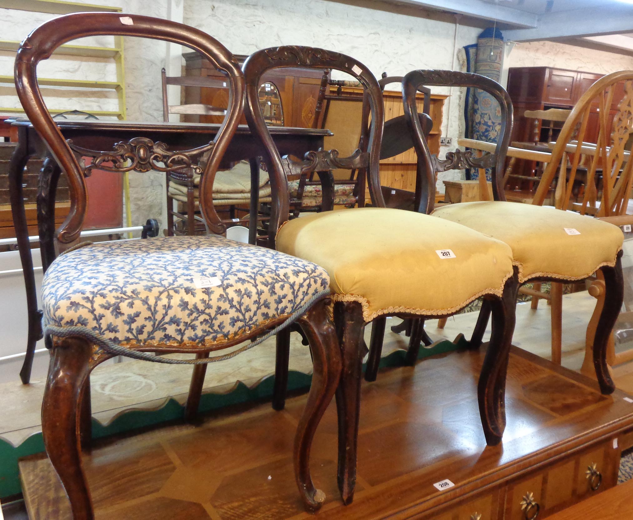 Three matching Victorian mahogany framed balloon back dining chairs - sold with a pair similar -